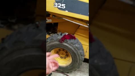 john deere 317 skid steer oil drain plug location|john deere 320 hydraulic oil tank.